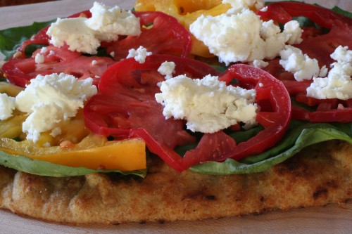 homemade pizzas with heirloom tomatoes